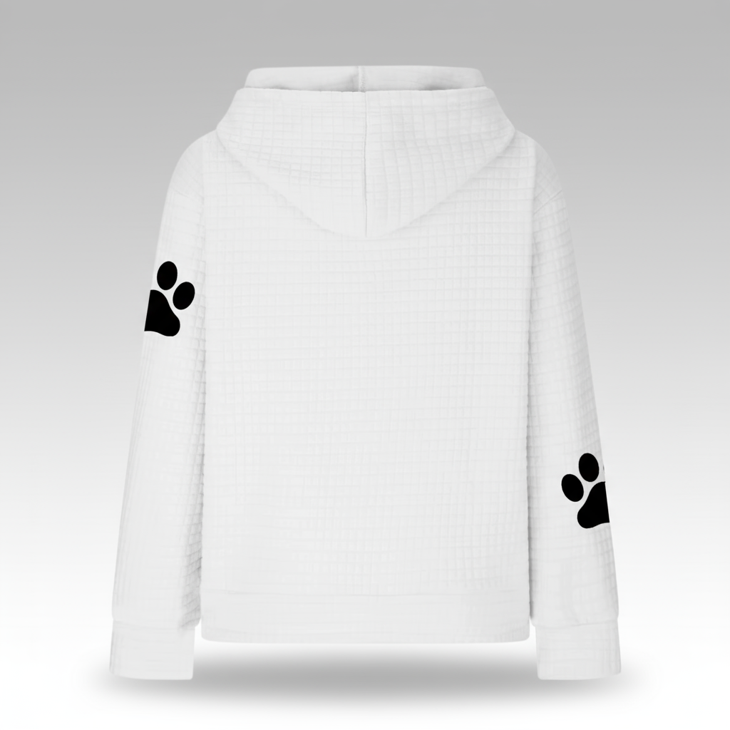 White hoodie with black paw prints on sleeves against a gray background