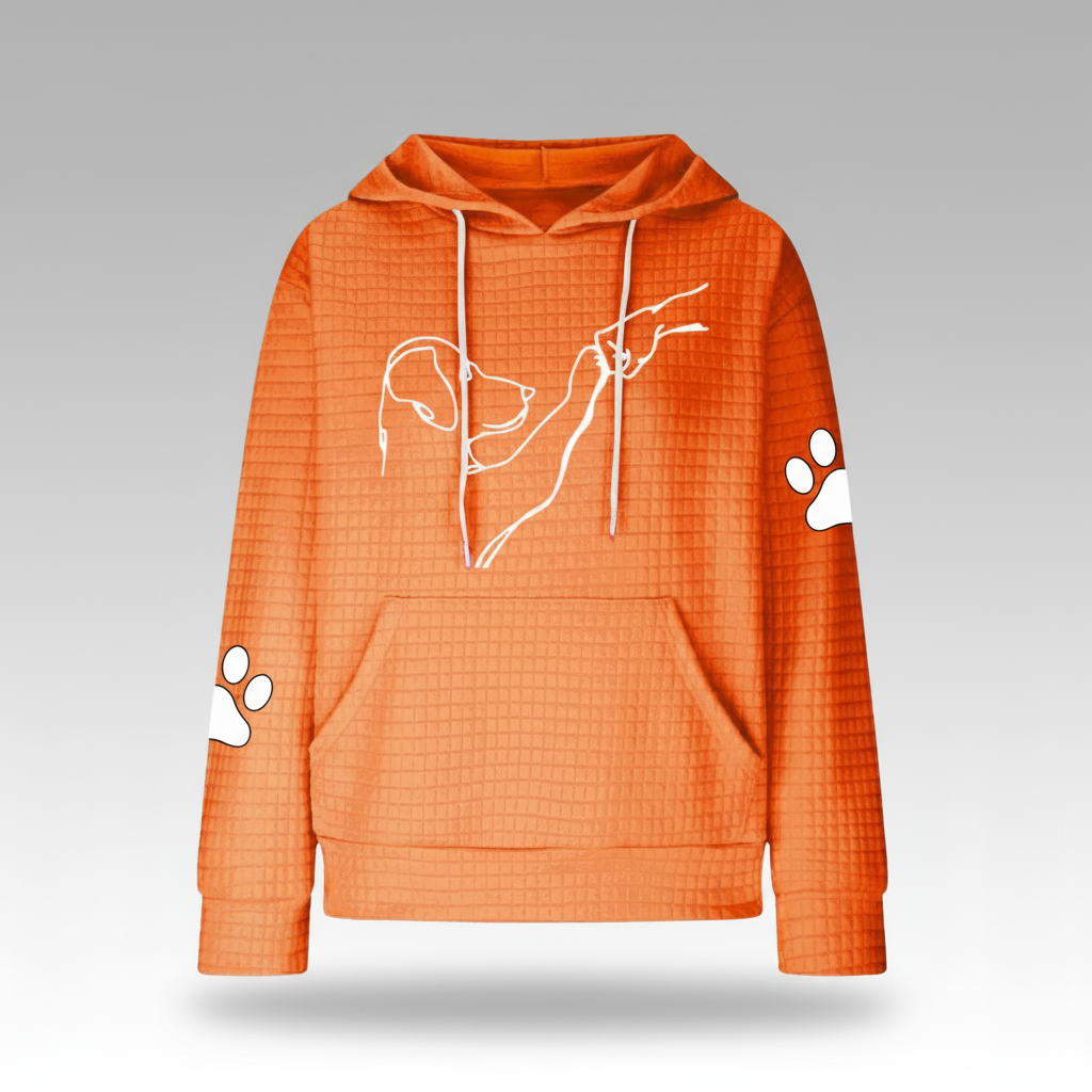 Orange hoodie with white paw prints and a dog outline on a gray background