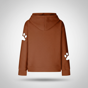 Brown hoodie with paw print designs on sleeves against a light gray background