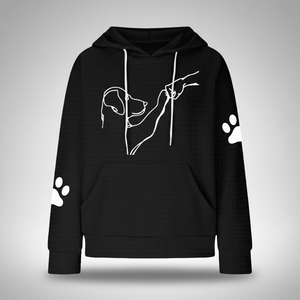 Black hoodie with white dog outline and paw prints on a gray background