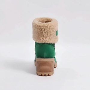 Green boot with beige fur lining on a white background