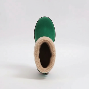 Green boot with beige fur lining on a white background