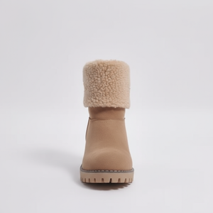 Tan winter boot with fuzzy cuff on a light gray background