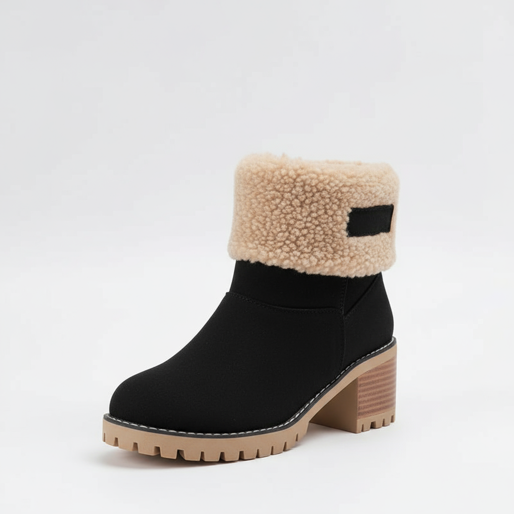 Black ankle boot with beige shearling collar on a white background