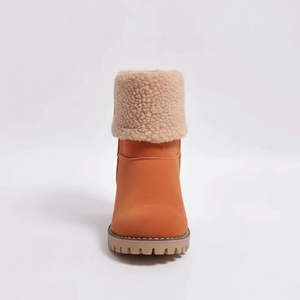 Orange winter boot with beige fur lining on a white background