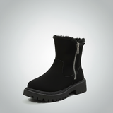 Black ankle boot with fur trim on a light gray background