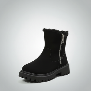 Black ankle boot with fur trim on a light gray background