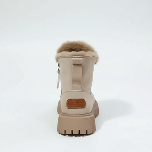 Beige winter boot with fur trim on a white background