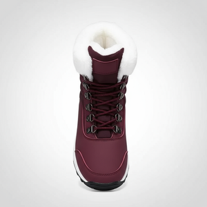 Maroon winter boot with white fur lining on a light gray background