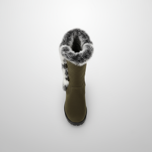 Green winter boot with fur trim on a white background