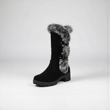 Black boot with fur trim on a white background