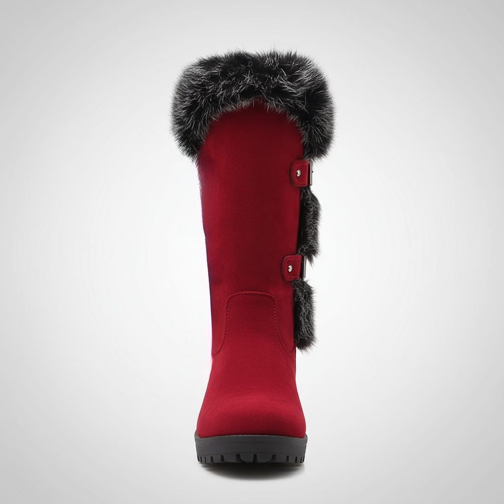 Red winter boot with fur trim on a light gray background