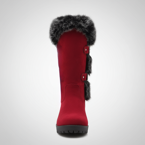 Red winter boot with fur trim on a light gray background