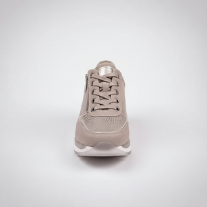 Beige sneaker on a light gray background