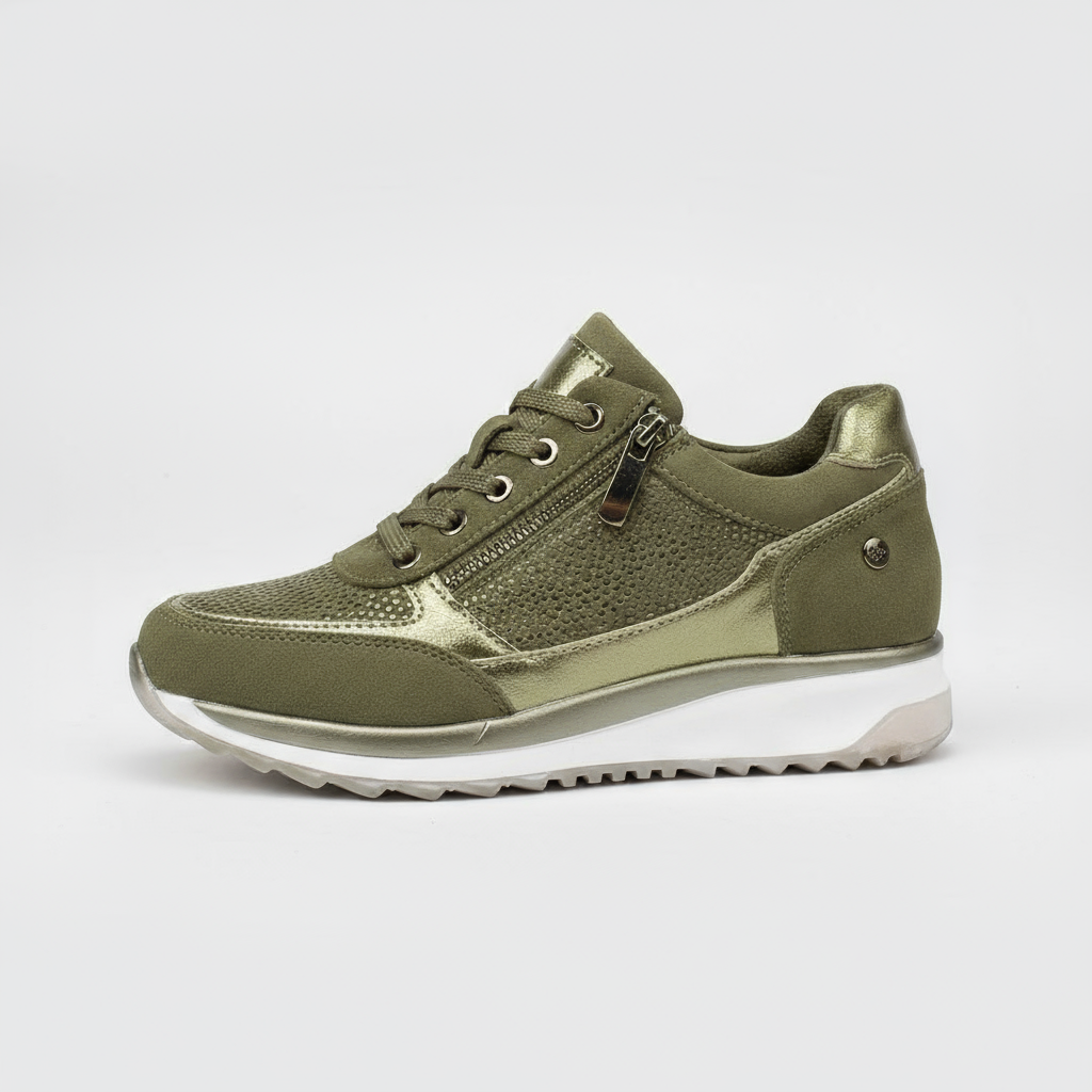 Green sneaker with white sole on a light gray background