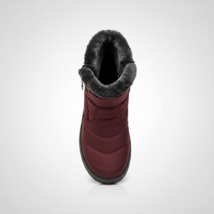 Red winter boot with gray fur lining on a white background