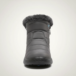 Gray winter boot with fur lining on a light gray background