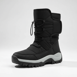 Black winter boot with gray sole on a white background