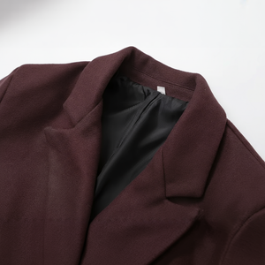 Close-up of a brown coat with a white background