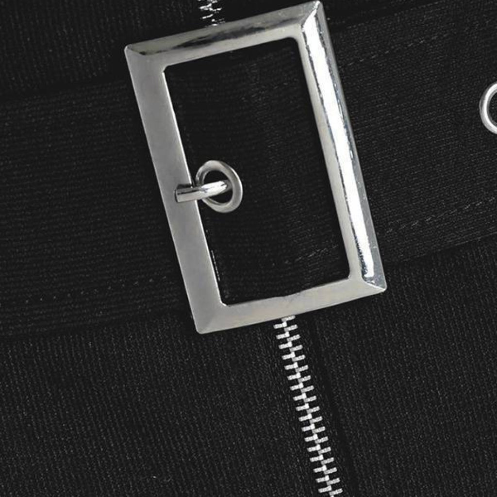 Close-up of a black jacket with a silver zipper and clasp.