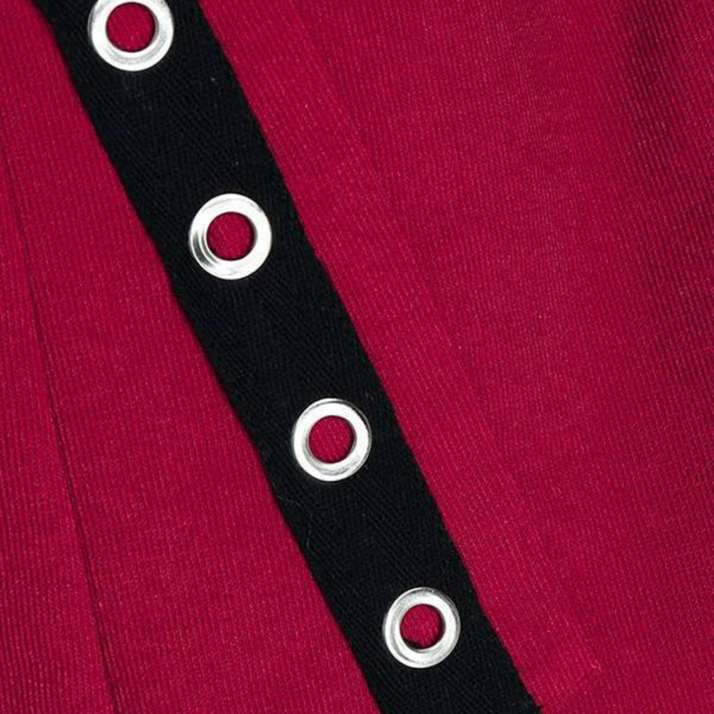 Black grommet strap with silver grommets on a red background