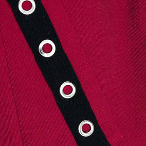 Black grommet strap with silver grommets on a red background